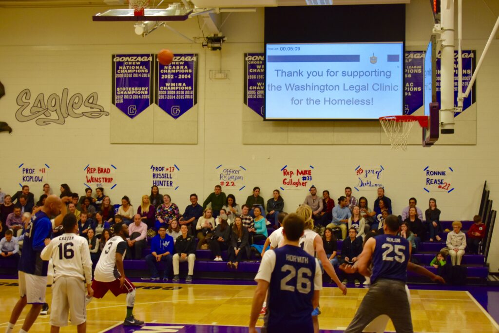Thank you for supporting the Washington Legal Clinic for the Homeless! is displayed on a sign over the Home Court game.