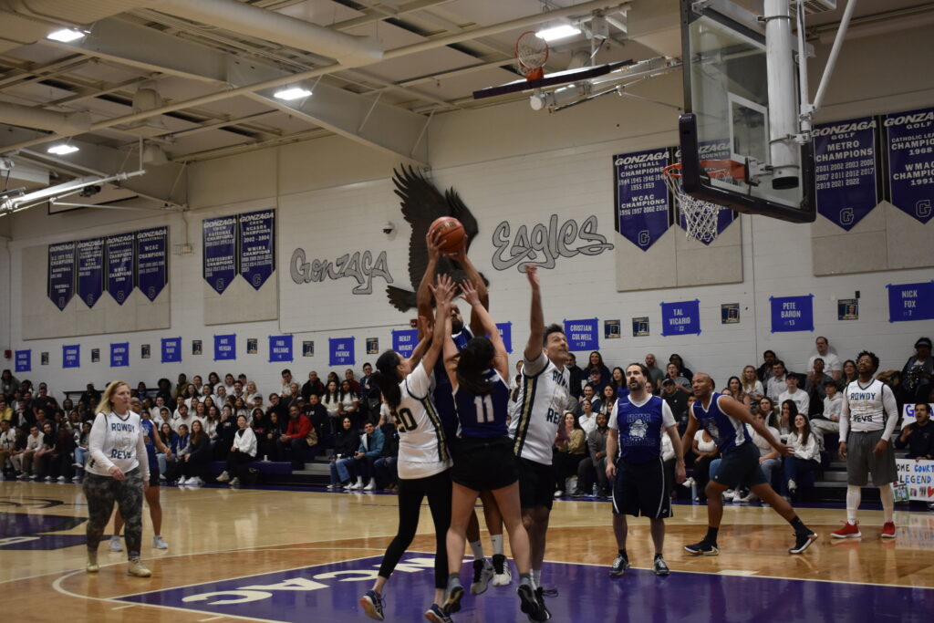 Players jump for the ball during the Home Court game.